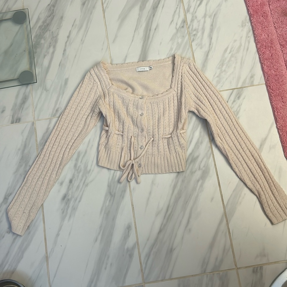 Sweater from a boutique. Cream. Dry clean only. Size small.